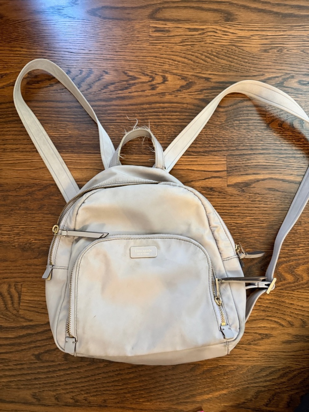 kate spade light purplish/gray mini backpack with gold hardware